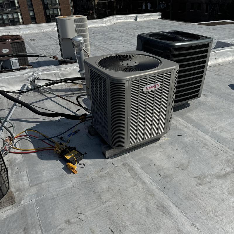 Lennox air conditioning units on rooftop maintenance