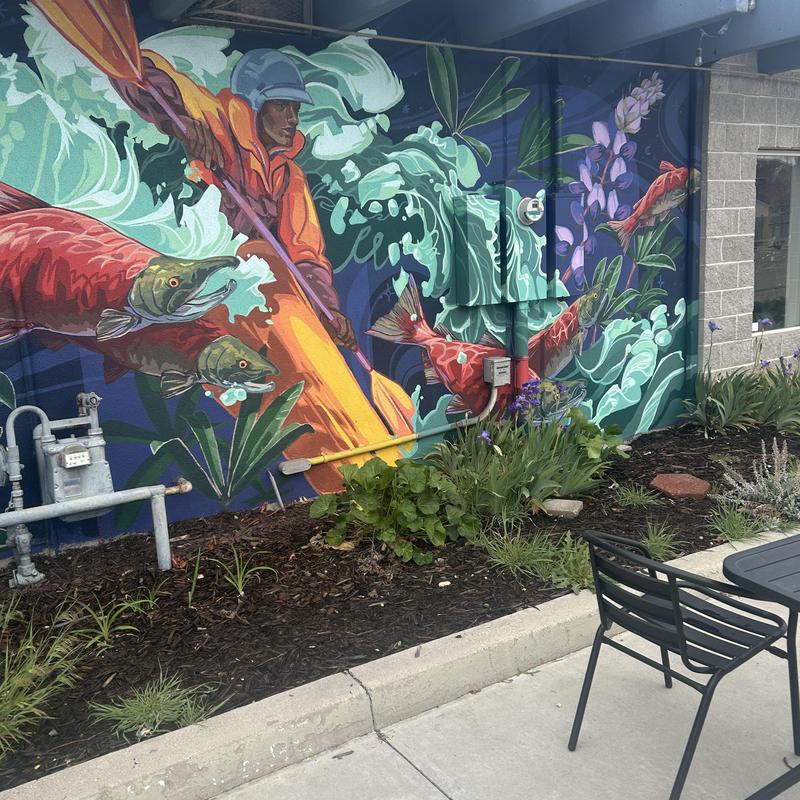 Gas meter and piping by mural and garden beds Gas meter and piping by mural and garden beds