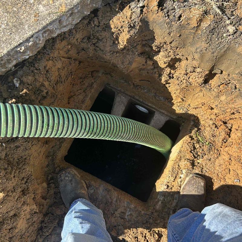 Septic tank with hose pumping waste out