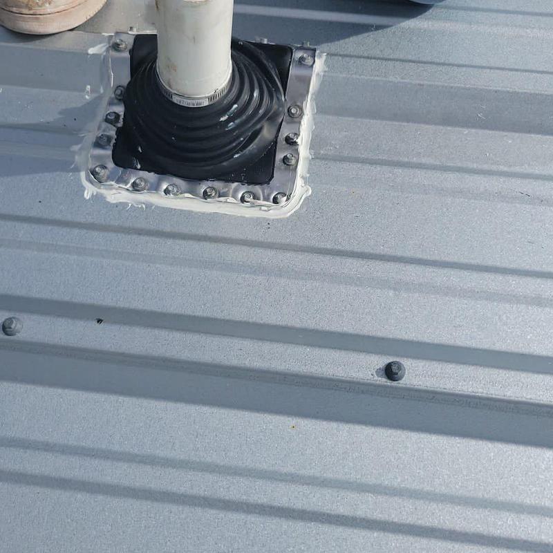 Metal roof plumbing pipe boot with sealant applied