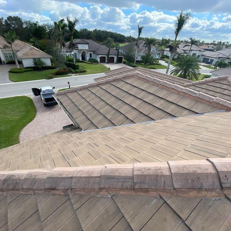 Concrete tile roof with repaired ridge tiles in Fort Myers