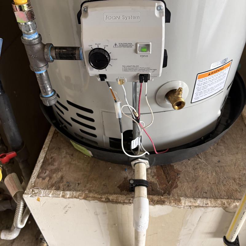 Gas water heater valve and burner assembly installed Gas water heater valve and burner assembly installed