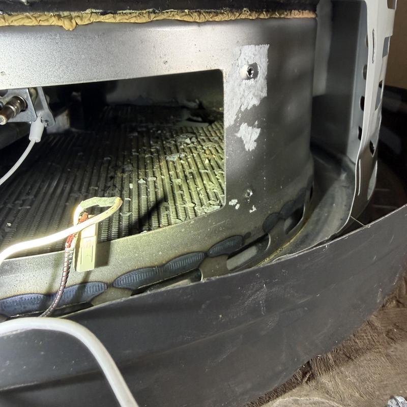 Gas water heater burner chamber with wiring exposed Gas water heater burner chamber with wiring exposed