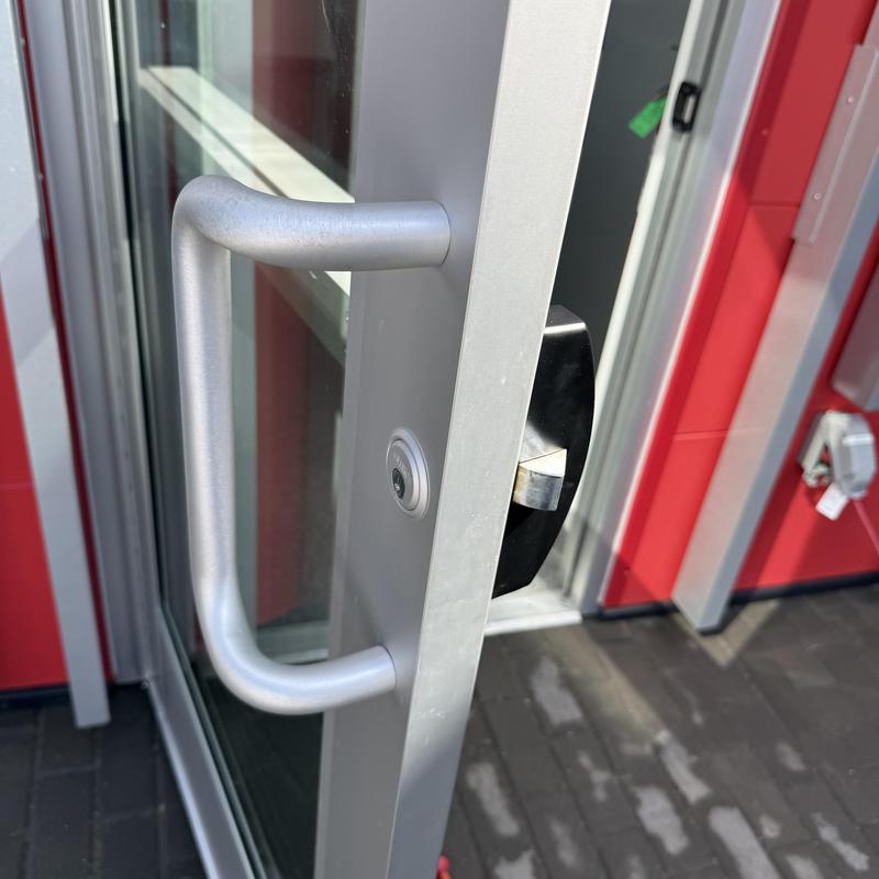 Exit device and lock cylinder on commercial door