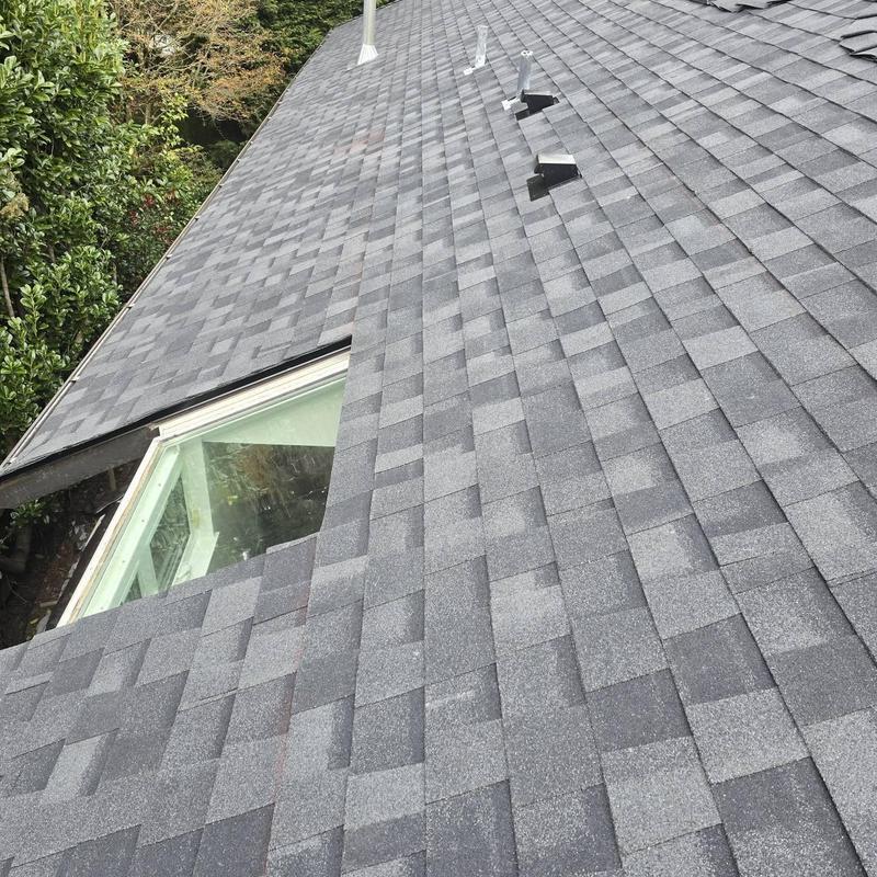 Asphalt shingle roof with skylight installation in Kirkland