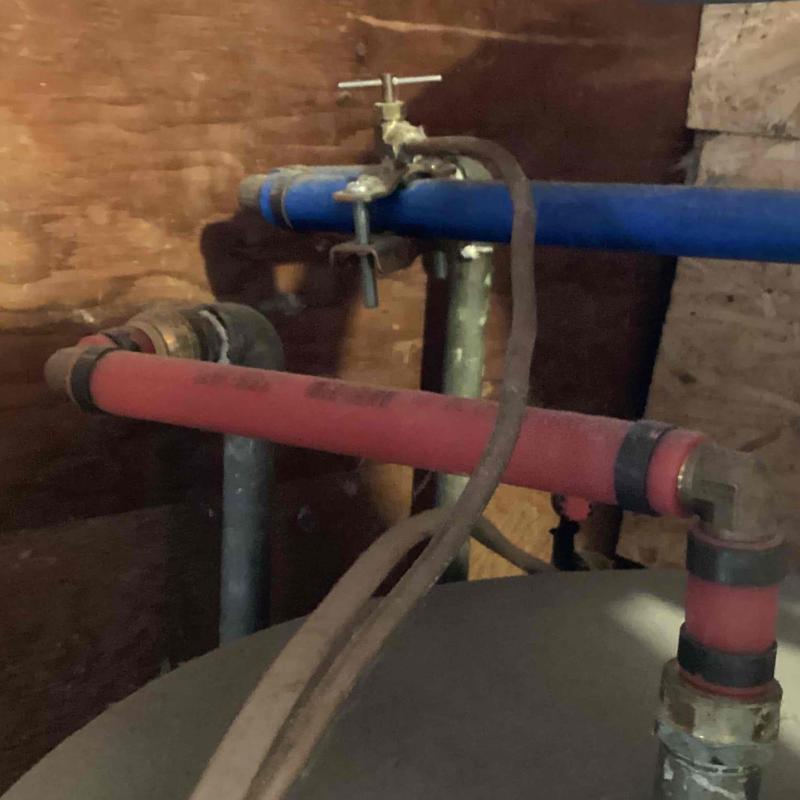 Water heater piping with shutoff valve and expansion tank pipe