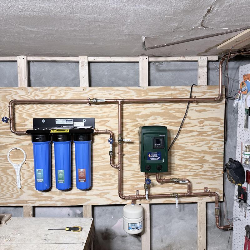 RO water filtration system with booster pump installed