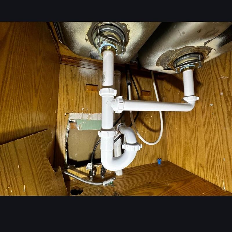 P-trap and extension pipe under double kitchen sink
