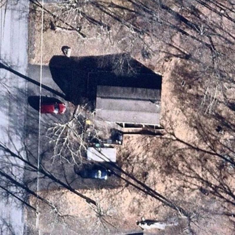 Roof shingles and chimney inspection from aerial view