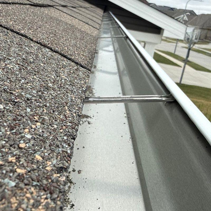 Seamless aluminum gutter and downspout installation