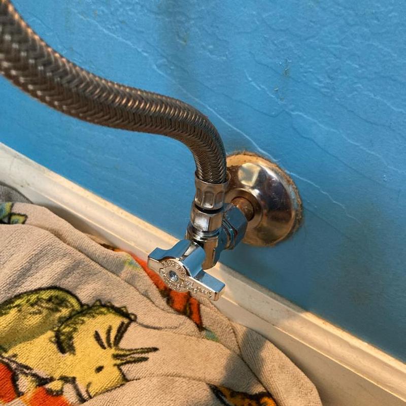 Toilet angle stop valve with braided supply line