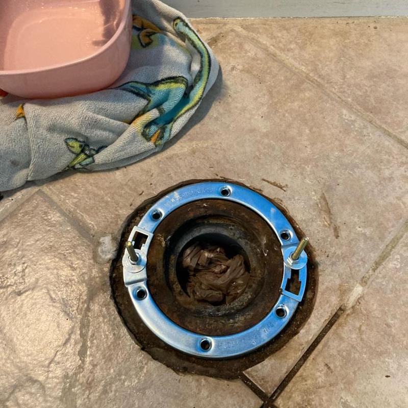 Closet flange installation on bathroom floor tiles