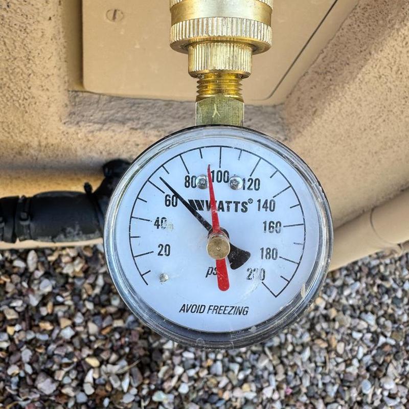 Pressure reducing valve gauge showing water pressure