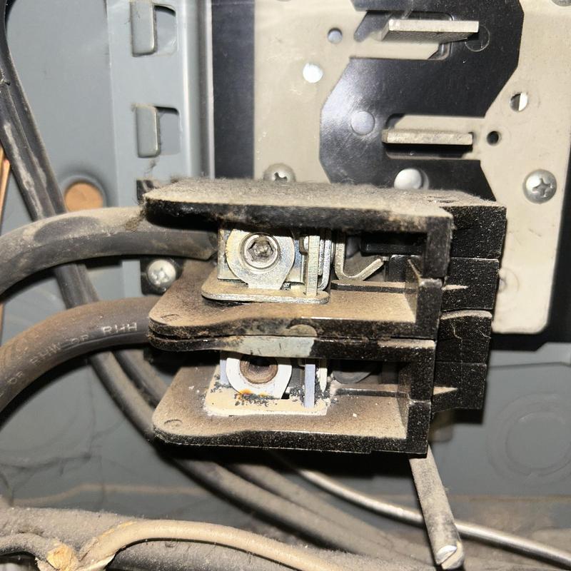 Main breaker terminal connection with wiring and dust buildup