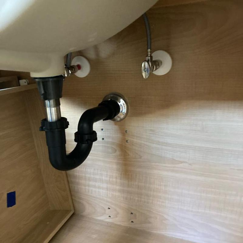 Lavatory drain trap and water supply valves under sink
