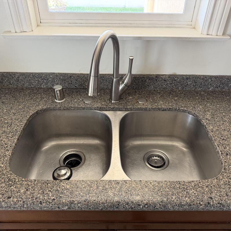 Kitchen sink faucet with air gap and covers installed Kitchen sink faucet with air gap and covers installed