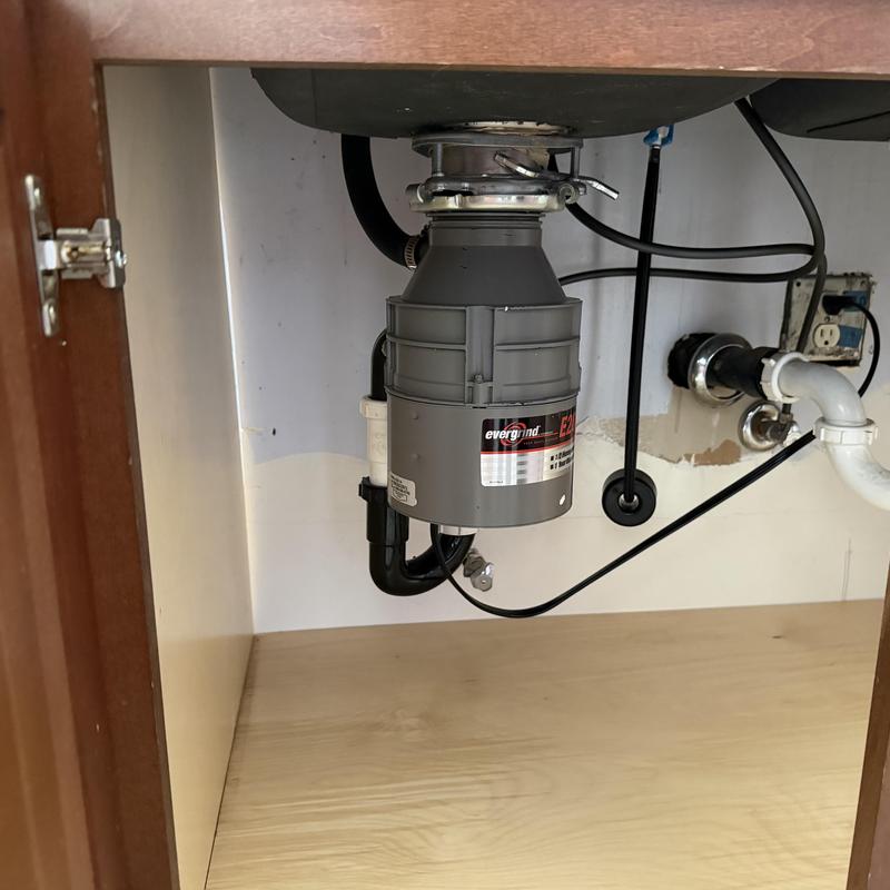 Garbage disposal installation under kitchen sink Garbage disposal installation under kitchen sink