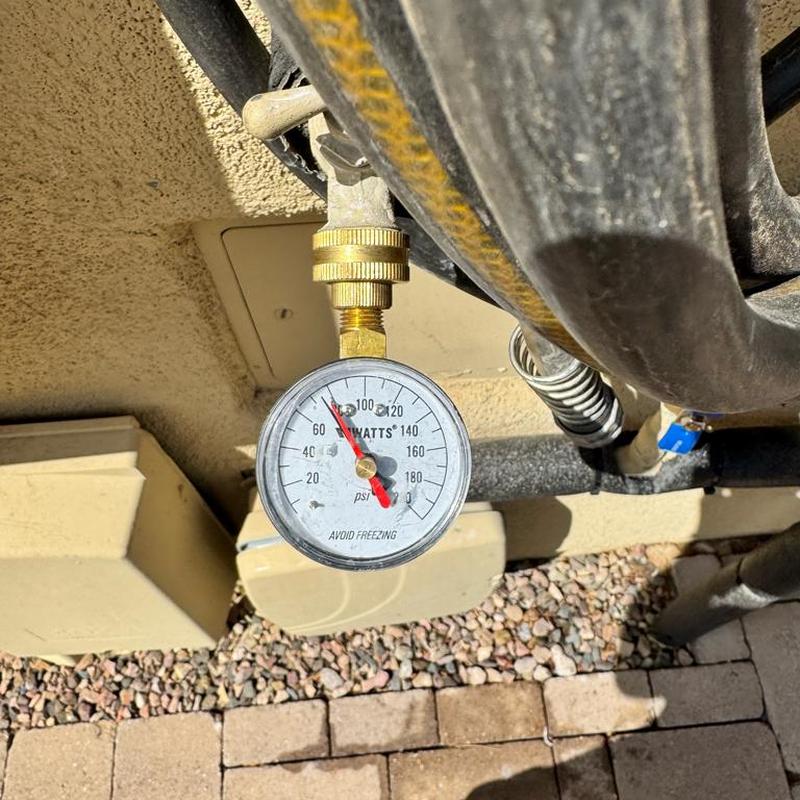 Pressure vacuum breaker gauge on outdoor pipe fitting