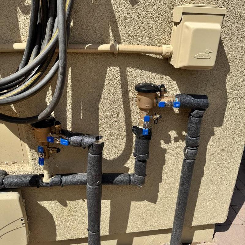 Pressure vacuum breakers with insulation on piping