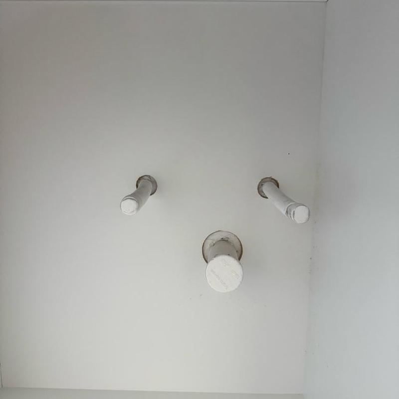 Faucet supply lines and drain pipe capped on wall