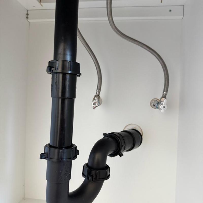 ABS drain and P-trap assembly with supply lines