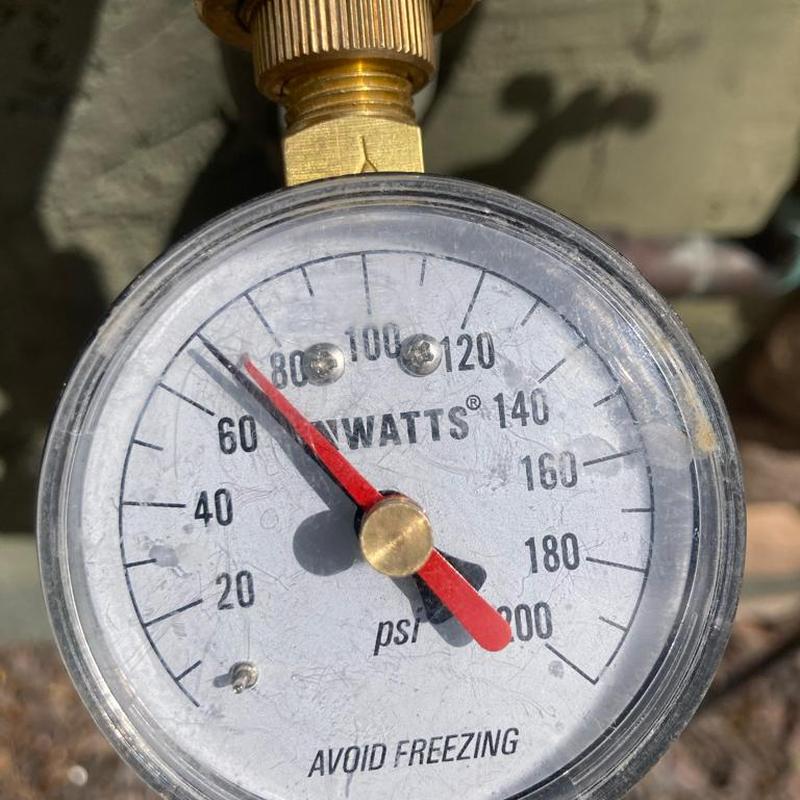 Pressure reducing valve gauge showing 70 psi pressure