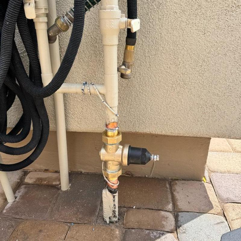 Pressure reducing valve on outdoor plumbing riser
