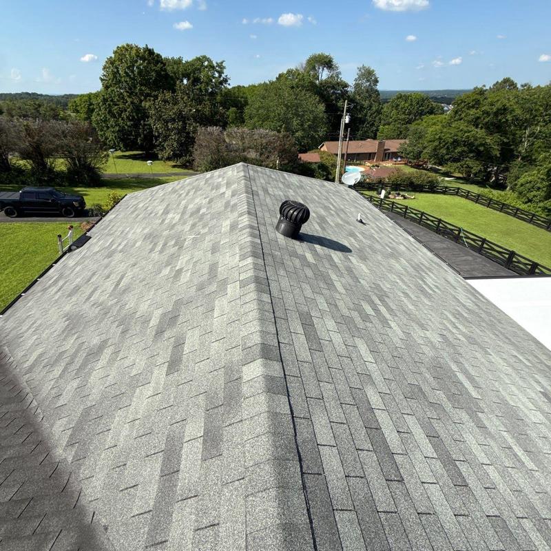Asphalt shingle roof with ventilation turbine installed