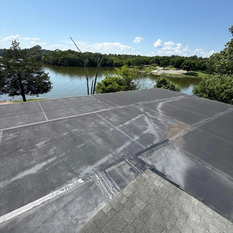 Flat roof membrane with sealed seams near lake view