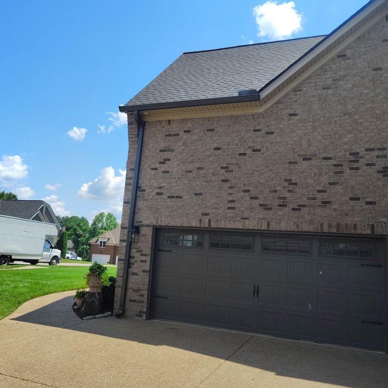 Roof shingles and flashing with early hail damage