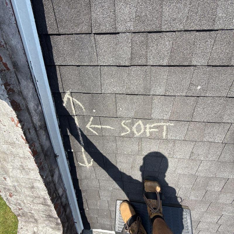 Roof shingles with soft spot marked in chalk