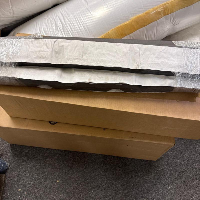 Roof flashing materials stacked on cardboard boxes