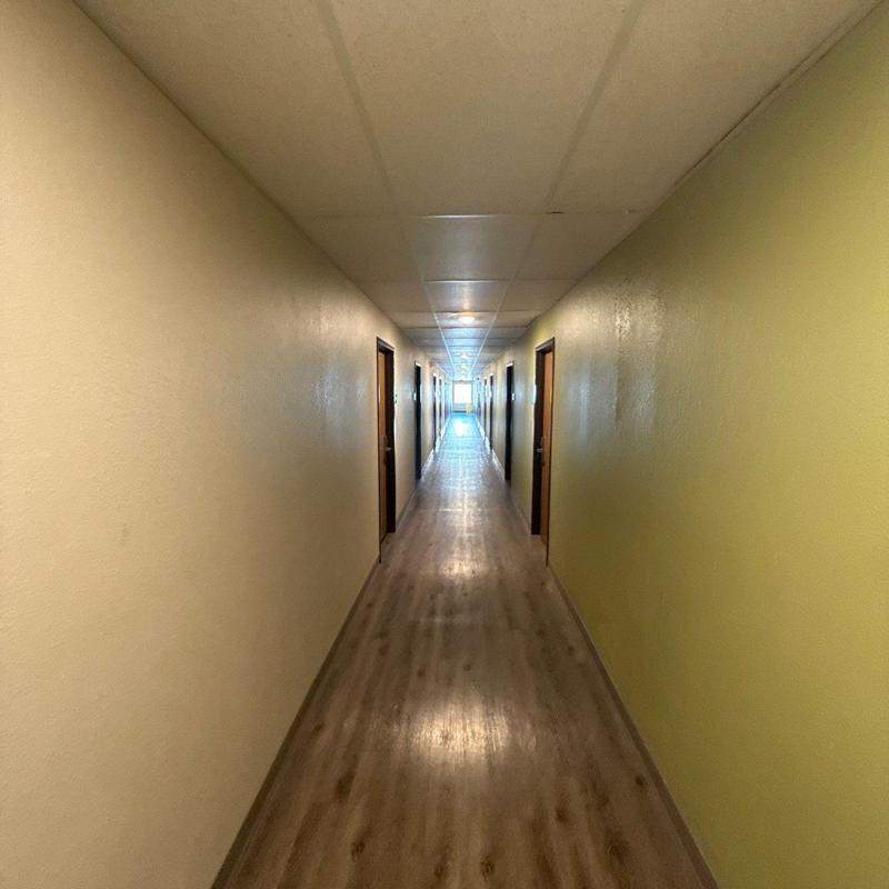 Commercial hallway flooring and ceiling tile inspection
