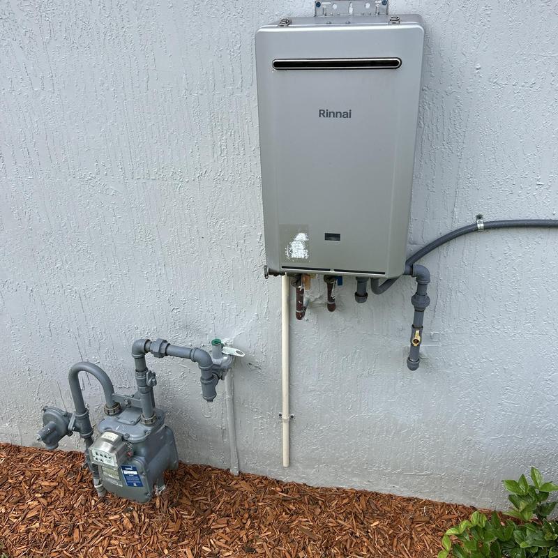 Tankless water heater and gas meter installation outside