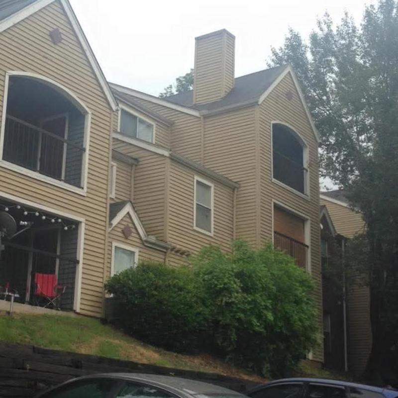 Chimney roof flashing and shingle replacement on apartment