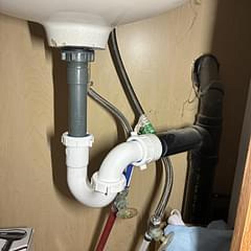 Sink trap and drain pipes installation under bathroom sink