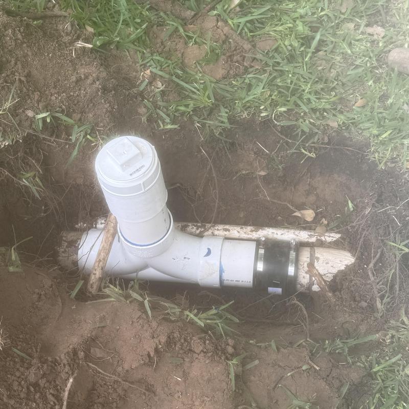 2-way sewer cleanout installation in ground dirt
