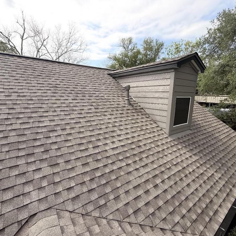 Shingle roof and dormer with vent pipe flashing