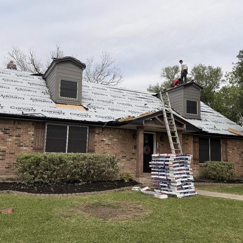 Roofing underlayment installation on residential roof