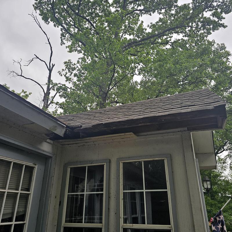 Roof shingles and fascia with hail damage