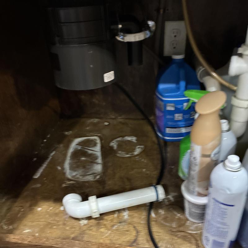 Garbage disposal unit installed under kitchen sink