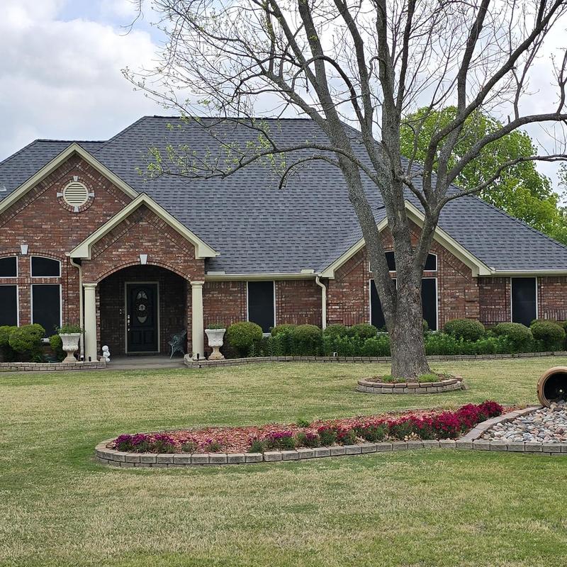 Asphalt shingle roof on brick residential home