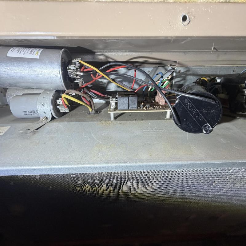 HVAC capacitor and wiring inside unit compressor panel