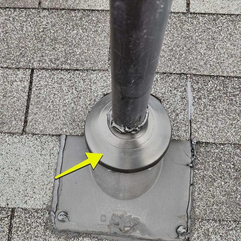 Pipe boot on shingle roof with sealant and flashing