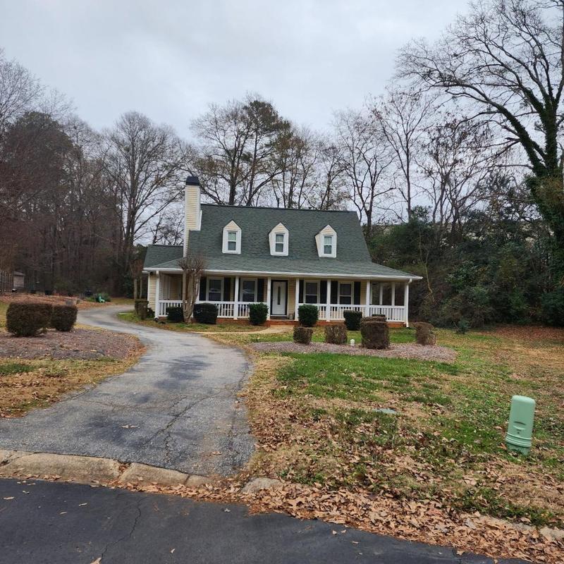 Corner window roof leak repair on residential house