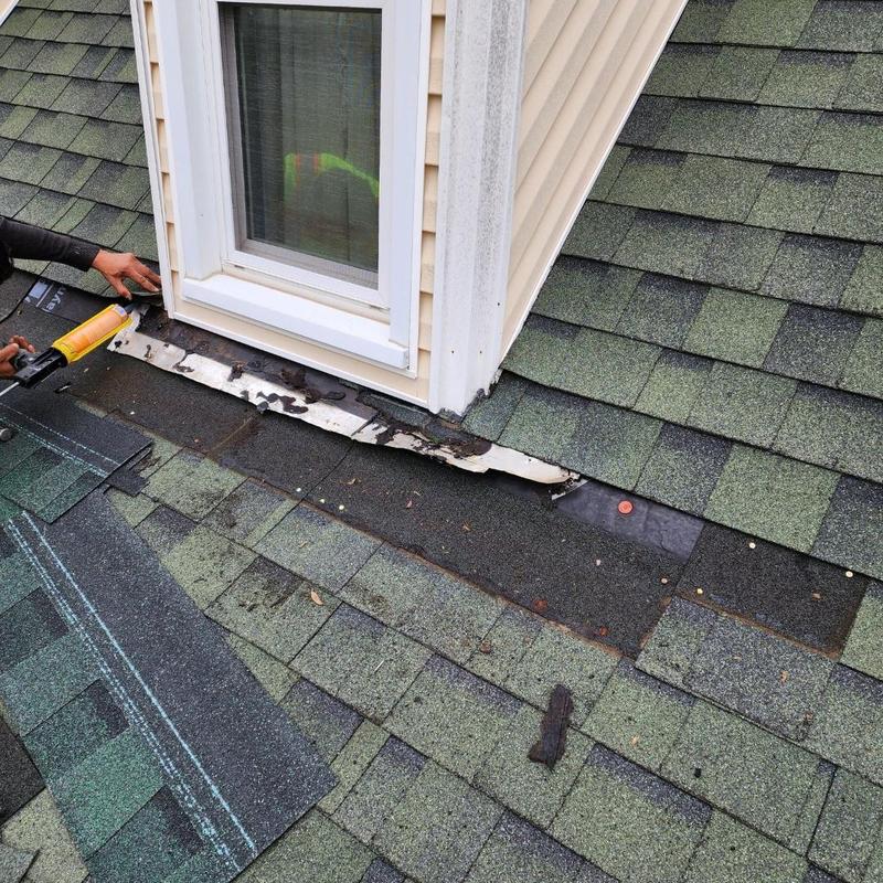 Corner window flashing on shingle roof repair job