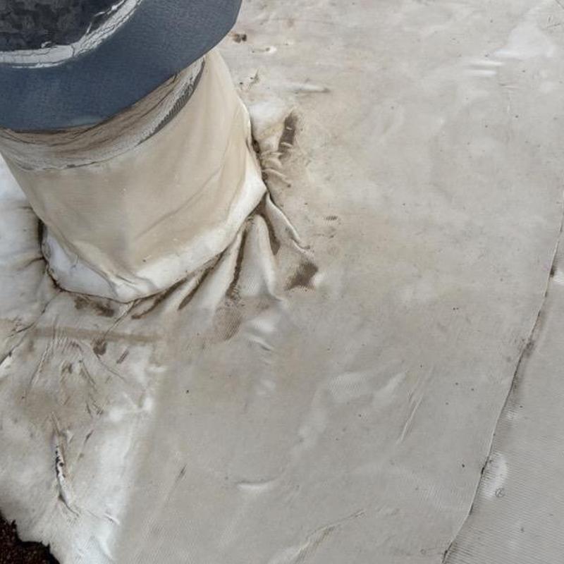 PVC commercial roof flashing with dirt and wear