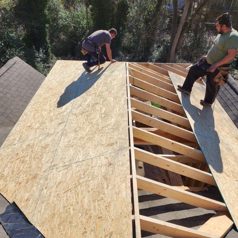 OSB roof decking installation on new construction roof