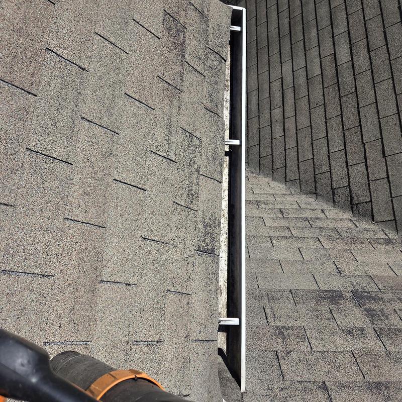 Gutter cleaning on asphalt shingle roof in Loganville, GA