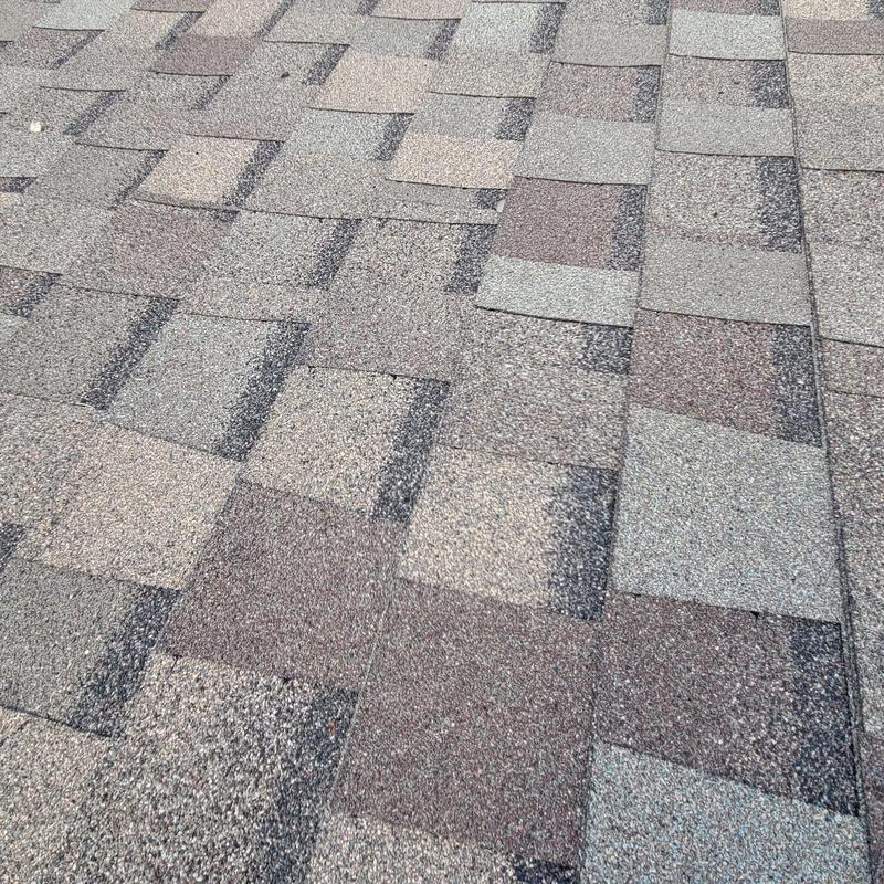 Asphalt shingle roof with wear and granule loss